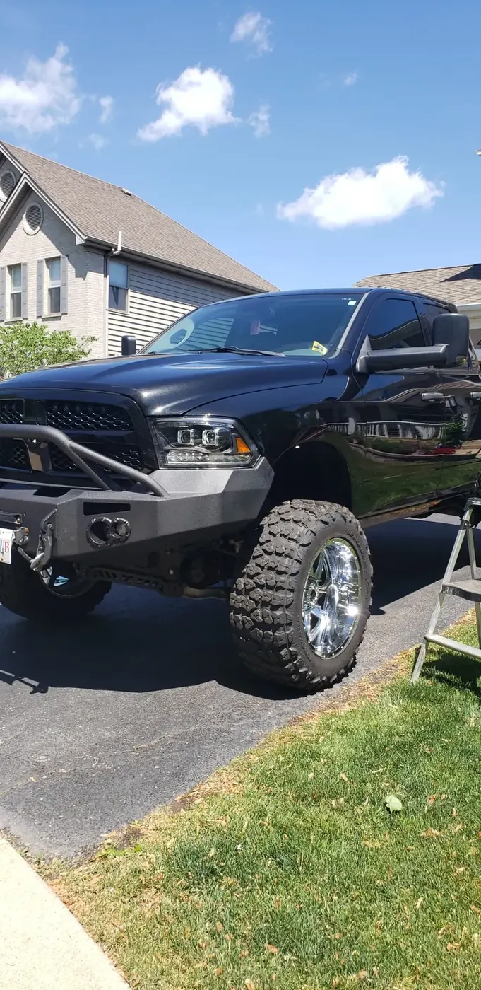 Lifted RAM truck after glass service